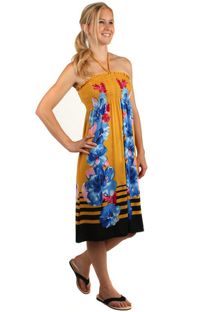 Letnia sukienka plażowa bez ramiączek z kwiatowym nadrukiem. Klapki na piersi. 65% poliester, 35% bawełna.